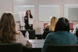 Women teaching retirement seminar.